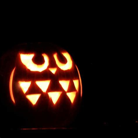 a carved pumpkin sitting on top of a table