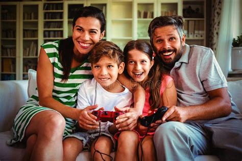 Parents Playing Video Games with Children Stock Image - Image of ...