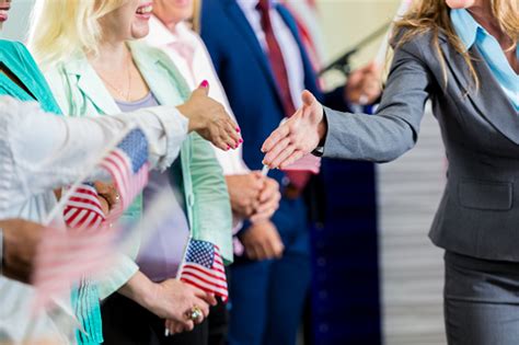 Female Politician Shaking Hands With Supporters At Event Stock Photo ...