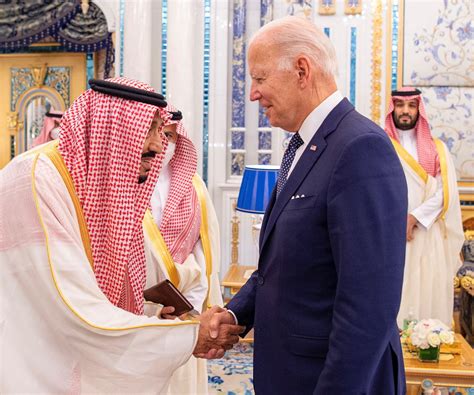 Biden meets Saudi king with a handshake, state news agency photo shows | Reuters