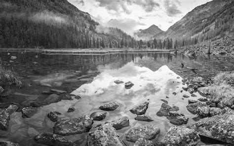 Premium Photo | Black and white landscape mountain lake reflection in the water