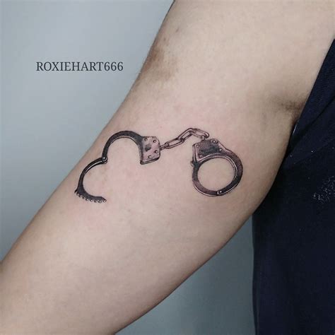 HANDCUFFS TATTOO BY ROXIEHART666