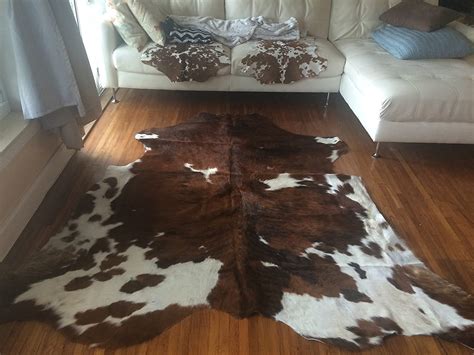 12 Best Cowhide Rug Ideas from Real, Tricolor, and Fake Cowhides [PHOTOS]