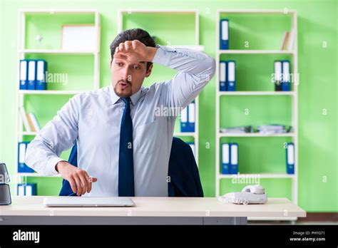 Employee doing exercises during break at work Stock Photo - Alamy