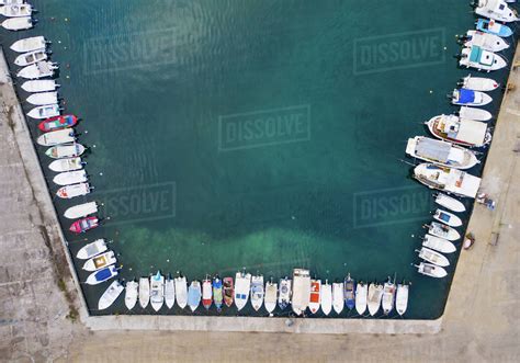 Top view of marina with moored boats and yachts. - Stock Photo - Dissolve