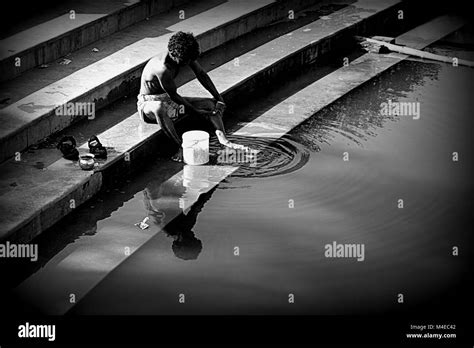 A man bathing on the Ganga Ghat, Varanasi, India Stock Photo - Alamy