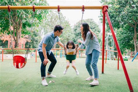 Image of young Asian family playing together at park 6907694 Stock Photo at Vecteezy