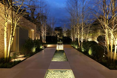 This unique outdoor lighting yard is certainly a striking design approach. #outdoor… | Garden ...