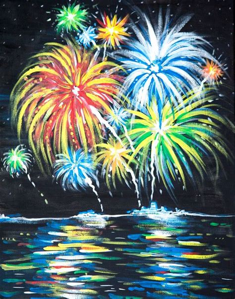 fireworks are lit up in the night sky above water and reflecting on the ...