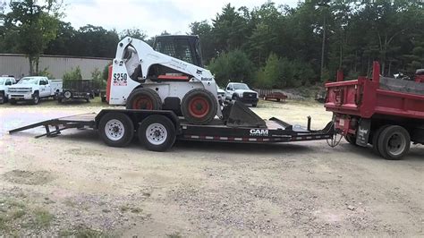 Loading and Unloading Bobcat Skid Steer on Trailer - YouTube