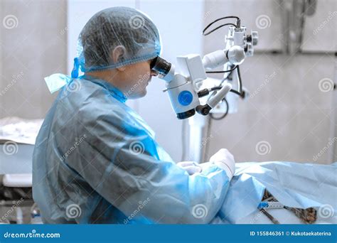 Ophthalmologist Surgeon Looking Through Surgical Microscope Doing Difficult Operation Royalty ...