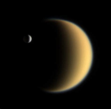 Two Moons Passing: Enceladus Transiting Titan [552x540] : spaceporn