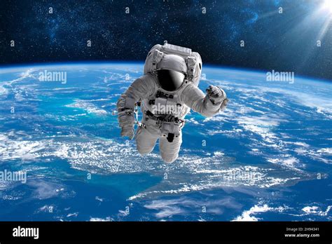 Astronaut in outer open space over the planet Earth.Stars provide the ...