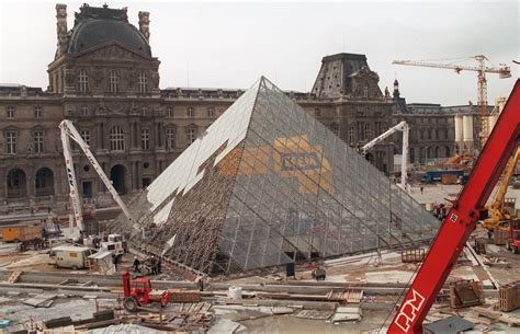 The Louvre Pyramid under construction 1988. Workers built the pyramid ...