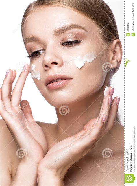 Beautiful Young Girl with Cream on the Skin, French Manicure. Beauty Face. Stock Image - Image ...