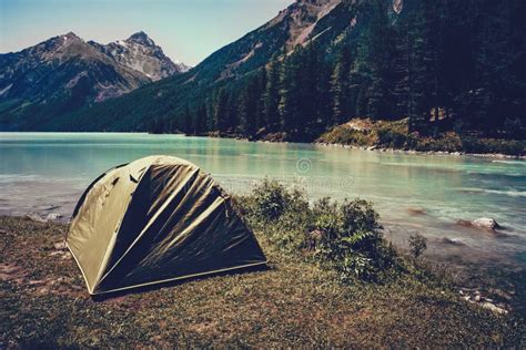 Camping Tent in the Nature. Mountains and Lake Stock Photo - Image of ...