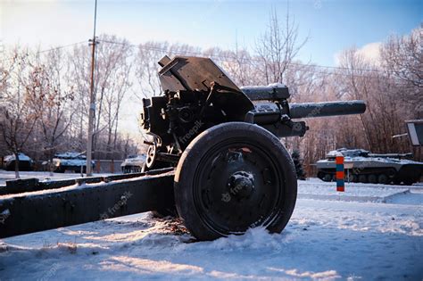 Premium Photo | Tank under the snow in the forest winter tank camouflage battle tank in the snow ...