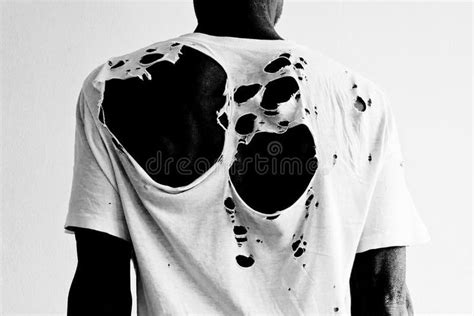 Back of a man wearing a torn white t-shirt. Back of a black man wearing a natura #Sponsored , # ...