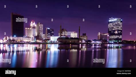 A panoramic view of downtown Toledo Ohio's skyline at night from across the Maumee River. A ...