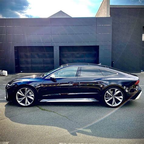 a black car parked in front of a building