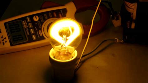 Electric arc inside 60w filament lamp. - YouTube