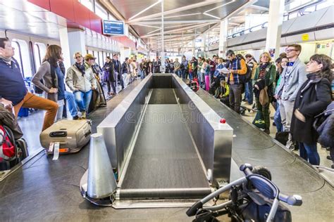 Passengers at the Baggage Carousel at the Airport Tegel Editorial Photography - Image of ...