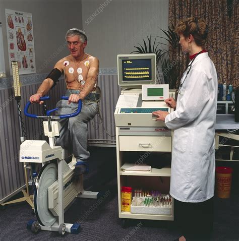 Supervised ECG stress test on male heart patient - Stock Image - M872/0323 - Science Photo Library