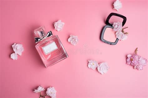 Perfume Bottle with Soft Pink Blush Around Flowers on Pink Background. Flat Lay Stock Image ...