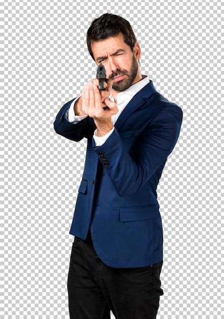 Premium PSD | Handsome man holding a pistol