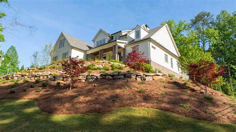 Hillside landscaping with natural stone and water accents in Smyrna, GA. | Bloom’n Gardens ...