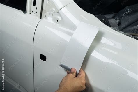 Auto body repair series: Comparing car color with color chart Stock Photo | Adobe Stock