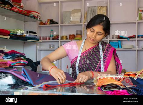 indian woman tailor or boutique owner at her workshop Stock Photo - Alamy