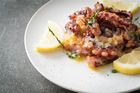 grilled octopus or squid with butter lemon sauce 4019821 Stock Photo at ...