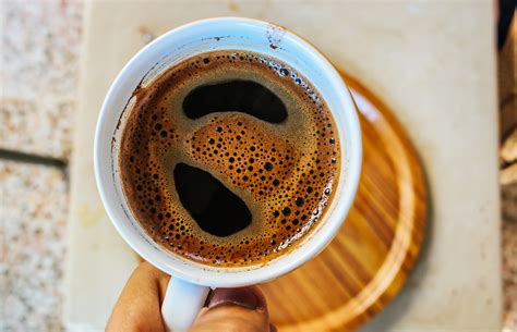 Selective Focus Photography Coffee Cup on Board · Free Stock Photo