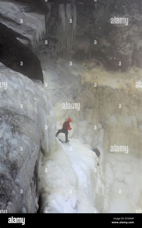 Ice climbers on the frozen Kinder Downfall waterfall, Wintertime, Kinder Scout, Peak District ...