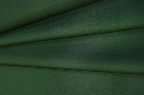 Premium Photo | Crumpled green wool fabric texture