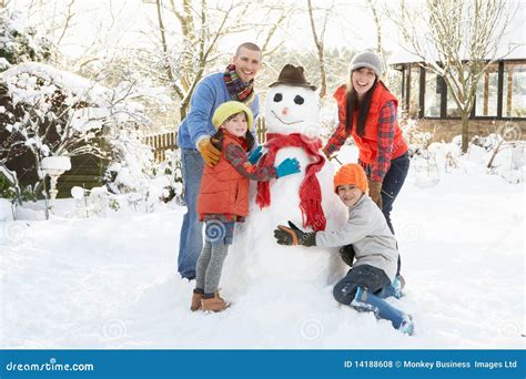 Family Building Snowman in Garden Stock Photo - Image of girl, building ...