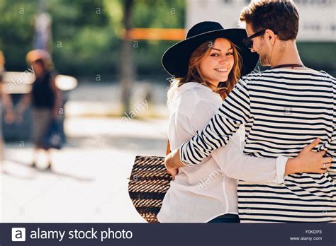 Young couple in love walking arm in arm Stock Photo - Alamy