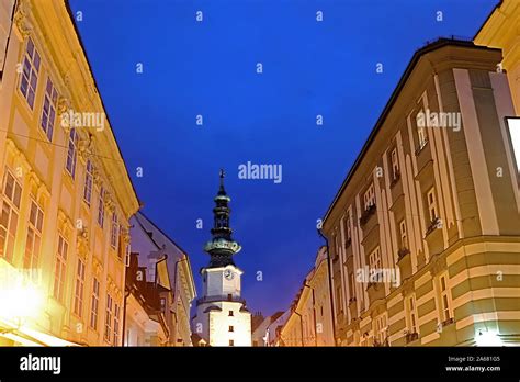 Top view of Saint Michael Gate and neighboring houses in the evening in Bratislava, Slovakia ...