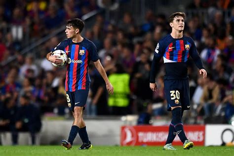 Pedri guides his Barcelona teammate Gavi through the red carpet at the ...