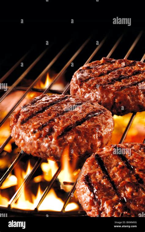 Flame grilled burger on a bbq food photos Stock Photo - Alamy