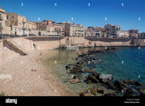 Cala Rossa beach on Lungomare di Ortigia Ortygia Siracusa Syracuse Sicily Italy Stock Photo - Alamy