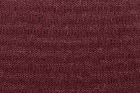 Premium Photo | Dark red background from textile material.