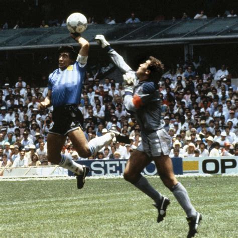 Diego Maradona scores the infamous Hand of God goal, 1986