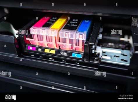 Close-up shot of a CMYK ink cartridges in a color printer Stock Photo - Alamy