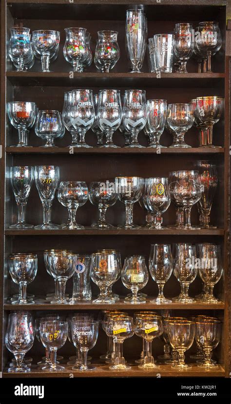 Assortment of beer glasses of different Belgian beers displayed on ...