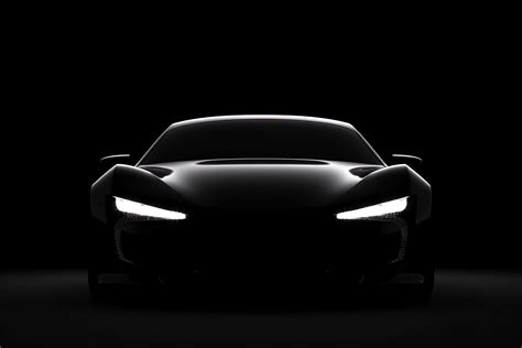 Front view dark silhouette of a modern sport black car isolated on ...