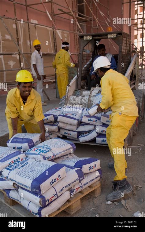 Cement bag bags cementation workers middle east Stock Photo - Alamy