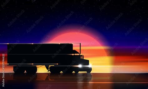 Truck moves on the highway at sunset. Classic big rig semi truck with ...