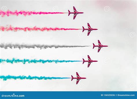 Red Arrows in formation stock photo. Image of formation - 136525036